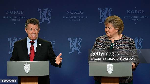 Norway's Prime Ministers Erna Solberg and this year's Nobel Peace Prize laureate Colombian President Juan Manuel Santos address a news conference...