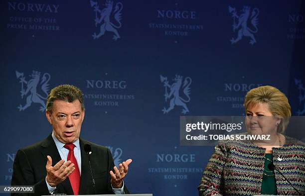 Norway's Prime Ministers Erna Solberg and this year's Nobel Peace Prize laureate Colombian President Juan Manuel Santos address a news conference...