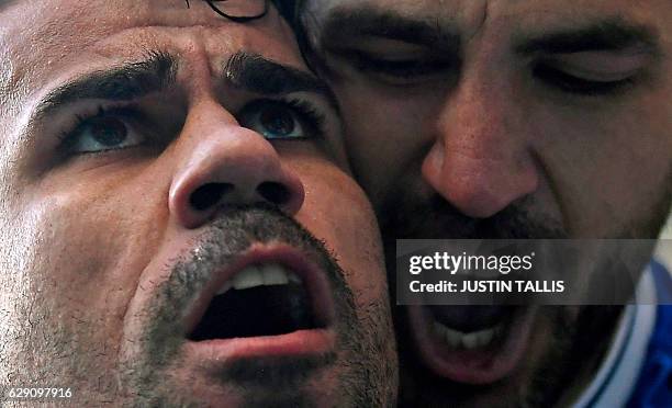 Chelsea's Brazilian-born Spanish striker Diego Costa celebrates with Chelsea's Spanish midfielder Cesc Fabregas after scoring the opening goal of the...