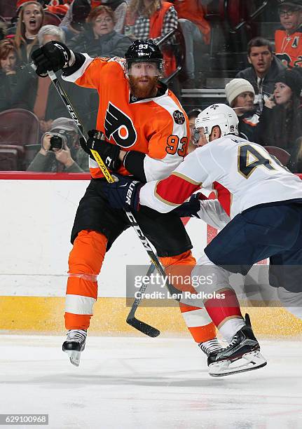 Jakub Voarcek of the Philadelphia Flyers battles against Jakub Kindl of the Florida Panthers on December 6, 2016 at the Wells Fargo Center in...