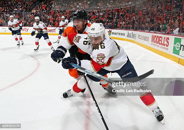 Michael Raffl of the Philadelphia Flyers battles against Jakub Kindl of the Florida Panthers on December 6, 2016 at the Wells Fargo Center in...