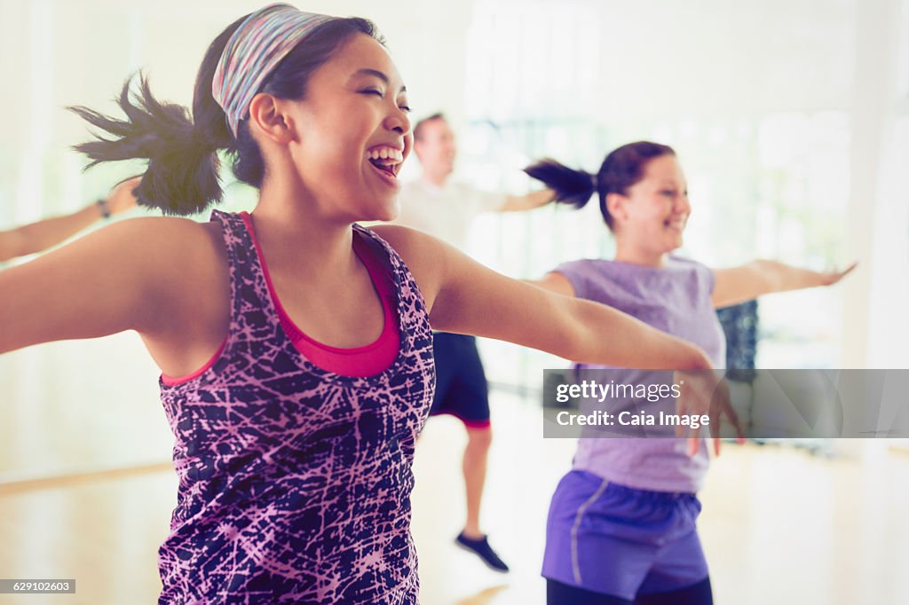 Enthusiastic women enjoying aerobics class