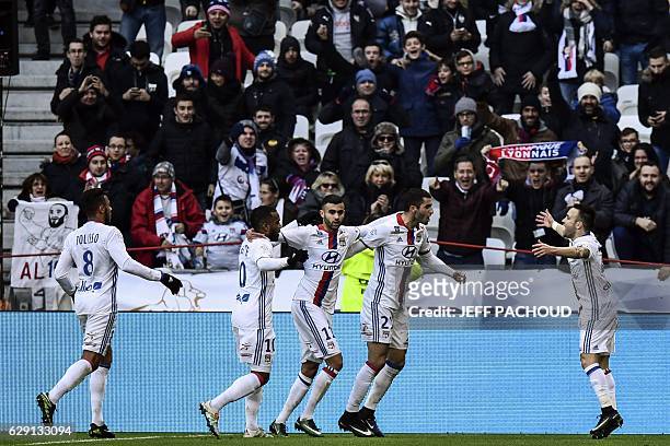 Lyon's French forward Mathieu Valbuena celebrates with his teammates after scoring a goal during the French L1 football match Olympique Lyonnais vs...