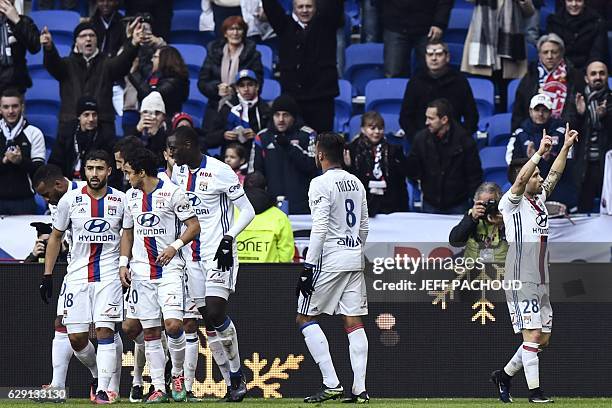 Lyon's French forward Mathieu Valbuena celebrates with his teammates after scoring a goal during the French L1 football match Olympique Lyonnais vs...