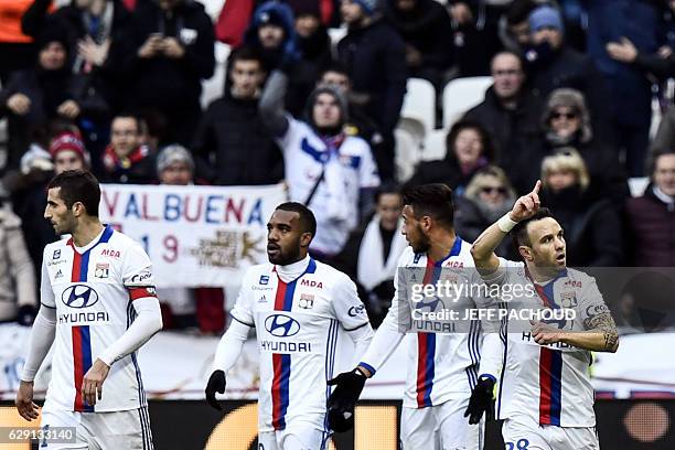 Lyon's French forward Mathieu Valbuena celebrates with his teammates after scoring a goal during the French L1 football match Olympique Lyonnais vs...