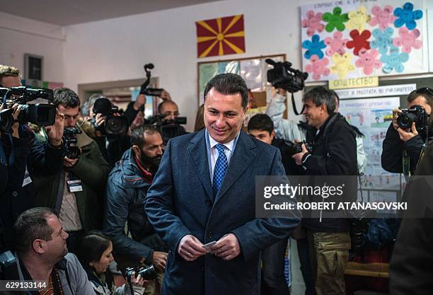 Macedonia's former prime minister and leader of the ruling VMRO DPMNE Nikola Gruevski arrives to cast his vote at a polling station in Skopje during...