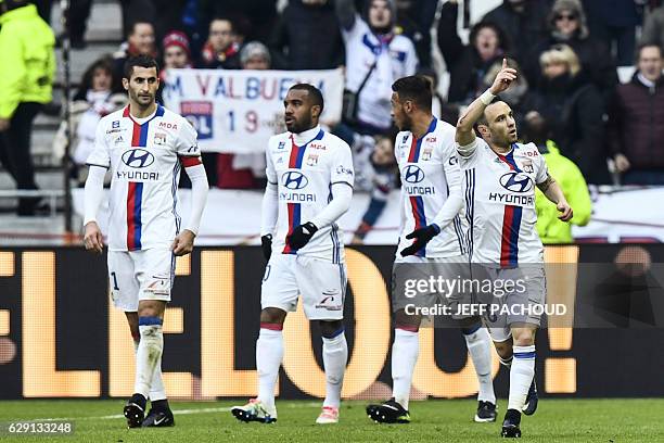 Lyon's French forward Mathieu Valbuena celebrates after scoring a goal during the French L1 football match Olympique Lyonnais vs Rennes on December...