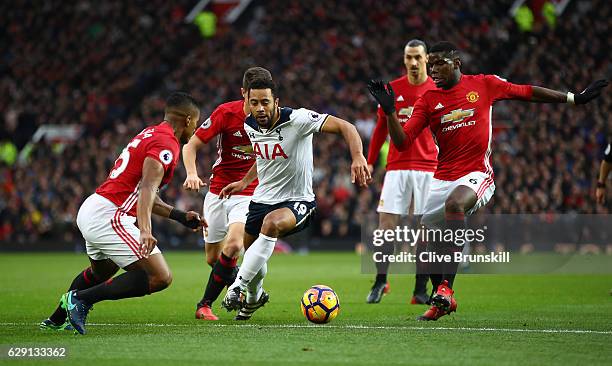 Mousa Dembele of Tottenham Hotspur controls the ball under pressure of Manchester United defense during the Premier League match between Manchester...