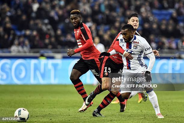 Lyon's French forward Alexandre Lacazette vies with Rennes'Algeria defender Ramy Bensebaini during the French L1 football match Olympique Lyonnais vs...