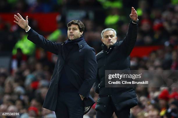 Mauricio Pochettino, Manager of Tottenham Hotspur and Jose Mourinho, Manager of Manchester United both gesture during the Premier League match...