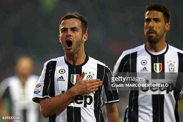 Juventus' Bosnian-Erzegovinan midfielder Miralem Pjanic celebrates after scoring a goal during the Italian Serie A football match between Torino and...