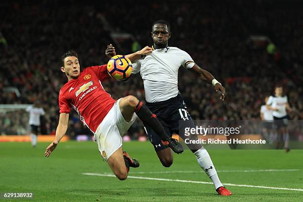 Moussa Sissoko of Tottenham Hotspur and Matteo Darmian of Manchester United compete for the ball during the Premier League match between Manchester...