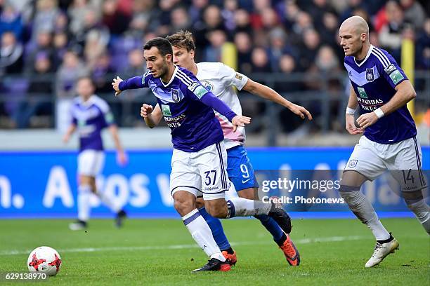 Jelle Vossen forward of Club Brugge is challenged by Ivan Obradovic defender of RSC Anderlecht and Bram Nuytinck defender of RSC Anderlecht during...