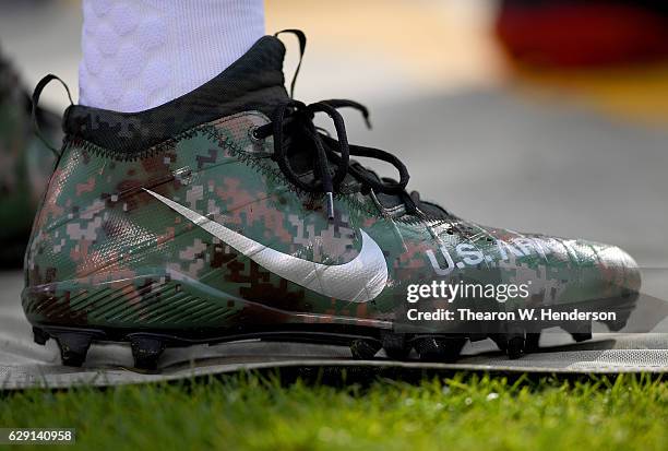 Detailed view of the special cleats worn by Jerry Hughes of the Buffalo Bills against the Oakland Raiders at the Oakland-Alameda Coliseum on December...