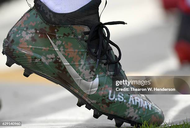 Detailed view of the special cleats worn by Jerry Hughes of the Buffalo Bills against the Oakland Raiders at the Oakland-Alameda Coliseum on December...