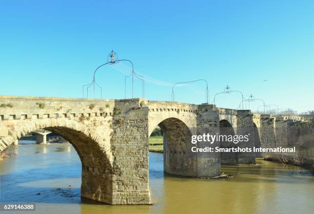 carcassonne's old bridge over aude river in france, a unesco heritage site - オードリバー ストックフォトと画像