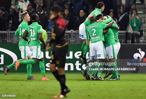 Saint-Etienne's players celebrate after scoring a goal during the French L1 football match between Saint-Etienne and Guinguamp on December 11, 2016...