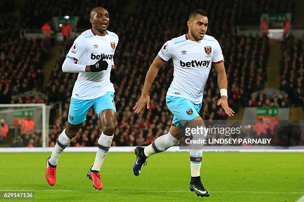 West Ham United's French midfielder Dimitri Payet celebrates after scoring their first goal during the English Premier League football match between...