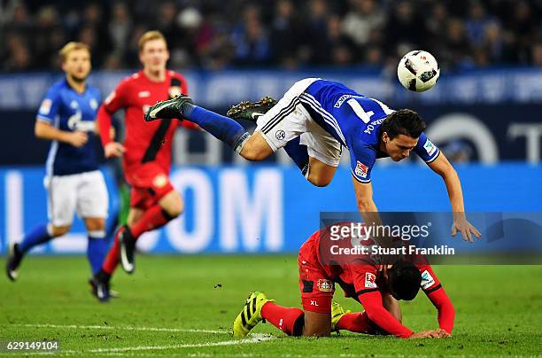 Yevhen Konoplyanka of Schalke battles for the ball with Benjamin Henrichs of Leverkusen during the Bundesliga match between FC Schalke 04 and Bayer...