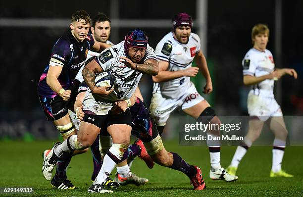 Ole Avei of Bordeaux Begles is tackled by Dave Ewers of Exeter Chiefs during the European Rugby Champions Cup match between Exeter Chiefs and...