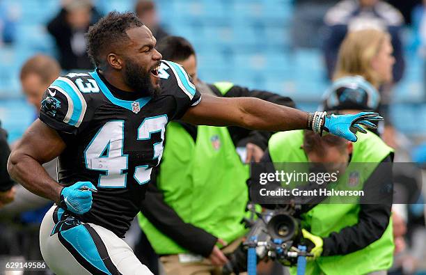 Fozzy Whittaker of the Carolina Panthers dances during pregame warm ups against the San Diego Chargers at Bank of America Stadium on December 11,...
