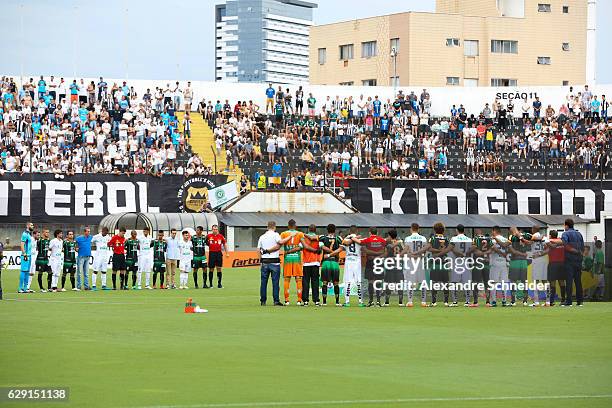 Players of Santos and Atletico MG pay homenage to the Chapecoense team before the match between Santos and America MG for the Brazilian Series A 2016...