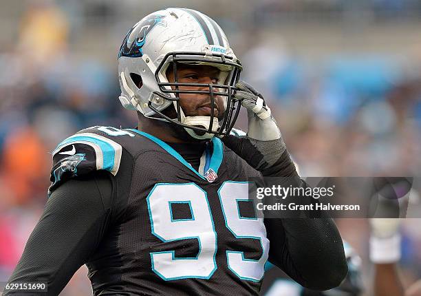 Kawann Short of the Carolina Panthers looks on after a play against the San Diego Chargers in the first quarter during the game at Bank of America...