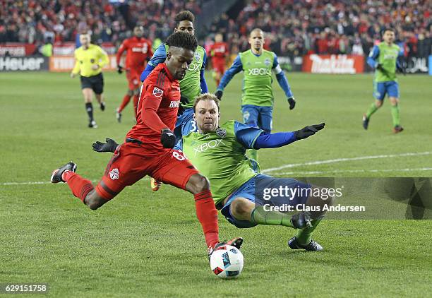 Chad Marshall of the Seattle Sounders looks to make a play against Tosaint Ricketts of the Toronto FC during the 2016 MLS Cup at BMO Field on...