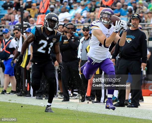 Adam Thielen of the Minnesota Vikings makes a catch in front of Prince Amukamara of the Jacksonville Jaguars during the game at EverBank Field on...