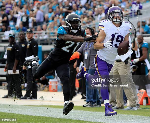 Prince Amukamara of the Jacksonville Jaguars pushes Adam Thielen of the Minnesota Vikings out of bounds during the game at EverBank Field on December...