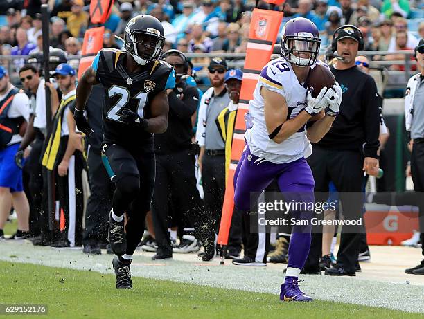 Adam Thielen of the Minnesota Vikings makes a catch along the sideline as Prince Amukamara of the Jacksonville Jaguars trails during the game at...