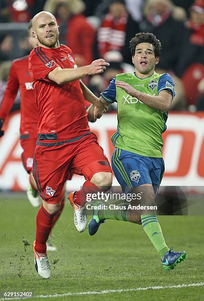 Nicolas Lodeiro of the Seattle Sounders plays against Michael Bradley of the Toronto FC in the 2016 MLS Cup at BMO Field on December 10, 2016 in...