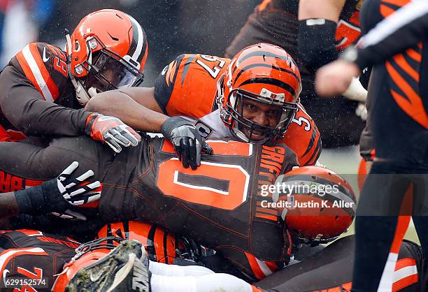 Vincent Rey of the Cincinnati Bengals tackles Robert Griffin III of the Cleveland Browns at Cleveland Browns Stadium on December 11, 2016 in...