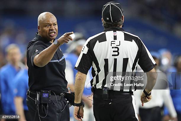 Detroit Lions head football coach Jim Caldwell argues with field judge Scott Edwards during the second quarter of the game against the Chicago Bears...