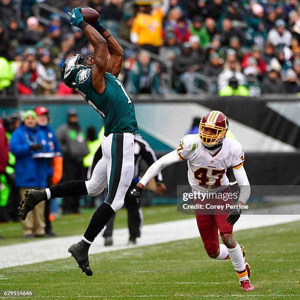 Nelson Agholor of the Philadelphia Eagles makes a reception in the first quarter as Quinton Dunbar of the Washington Redskins looks on at Lincoln...