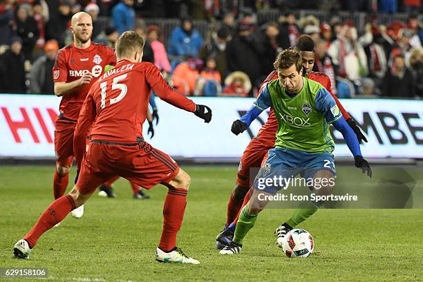 Seattle Sounders player Andreas Ivanschitz controls the ball against Toronto FC Defender Eriq Zavaleta during the MLS Cup final game between the...