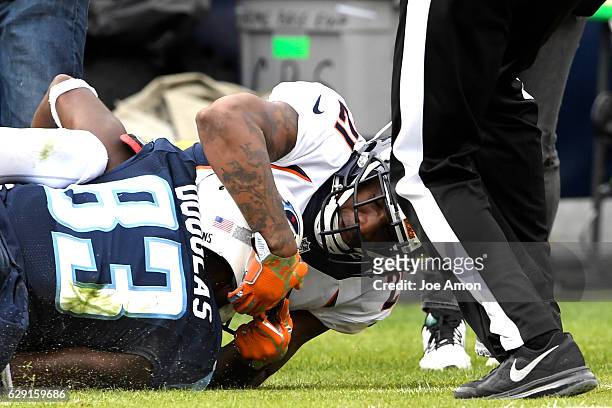 Aqib Talib of the Denver Broncos and Harry Douglas of the Tennessee Titans in a ruckus at Nissan Stadium, Nashville, TN December 11, 2016.
