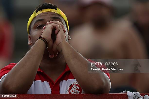 Fan of Internacional cries during a match between Fluminense and Internacional as part of Brasileirao Series A 2016 at Giulite Coutinho Stadium on...