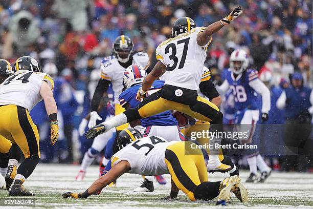 Brandon Tate of the Buffalo Bills is pursued by Jordan Dangerfield of the Pittsburgh Steelers during the first half at New Era Field on December 11,...