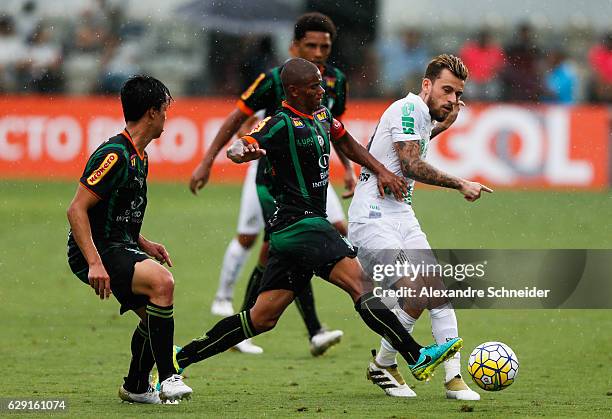 Helder of America MG and Lucas Lima of Santos in action during the match between Santos and America MG for the Brazilian Series A 2016 at Vila...