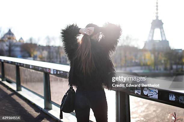 Sofya Benzakour, fashion and life style blogger @lacouleurdumoment, is wearing River Island shoes, Ikks blue denim jeans, an Ikks black bag, a black...