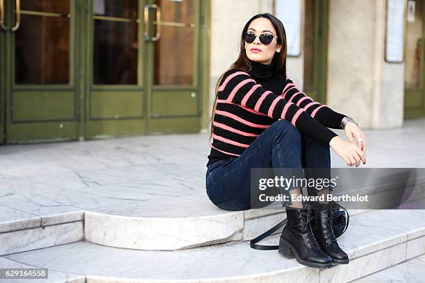 Sofya Benzakour, fashion and life style blogger @lacouleurdumoment, is wearing River Island shoes, Ikks blue denim jeans, an Ikks black bag, a black...