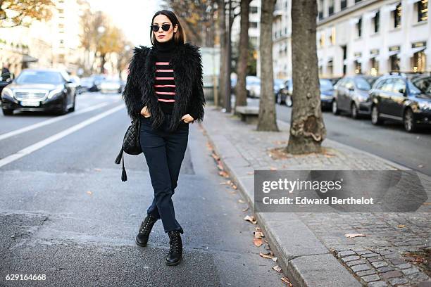 Sofya Benzakour, fashion and life style blogger @lacouleurdumoment, is wearing River Island shoes, Ikks blue denim jeans, an Ikks black bag, a black...