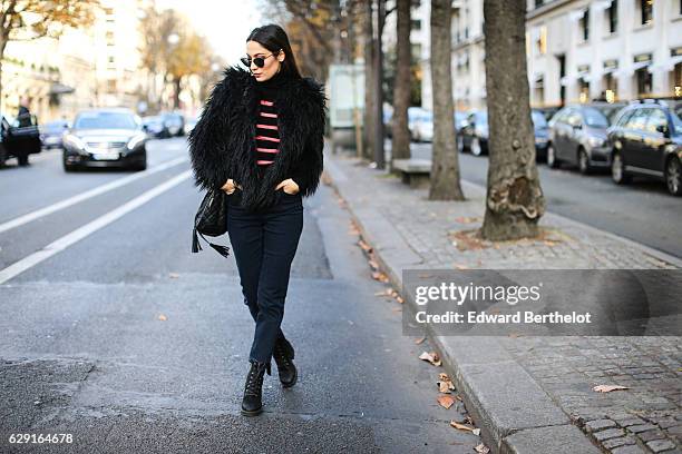 Sofya Benzakour, fashion and life style blogger @lacouleurdumoment, is wearing River Island shoes, Ikks blue denim jeans, an Ikks black bag, a black...