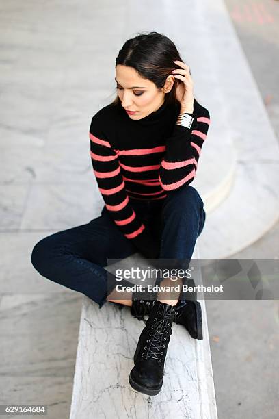 Sofya Benzakour, fashion and life style blogger @lacouleurdumoment, is wearing River Island shoes, Ikks blue denim jeans, an Ikks black bag, a black...