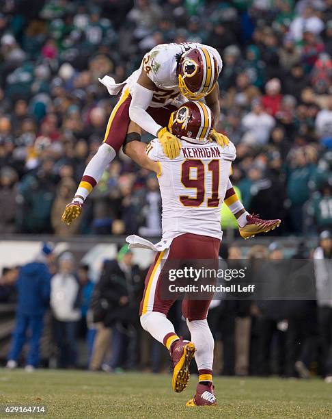 Ryan Kerrigan and Josh Norman of the Washington Redskins celebrate in the final moments of the game against the Philadelphia Eagles at Lincoln...