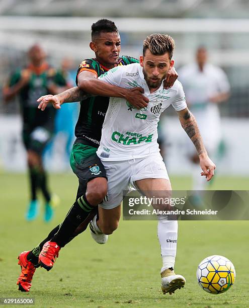 Renato Bruno of America MG and Lucas Lima of Santos in action during the match between Santos and America MG for the Brazilian Series A 2016 at Vila...