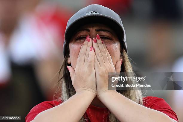 Fan of Internacional cries during a match between Fluminense and Internacional as part of Brasileirao Series A 2016 at Giulite Coutinho Stadium on...