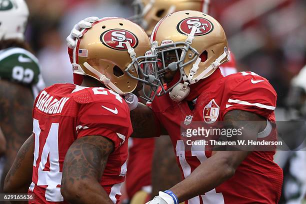 Shaun Draughn of the San Francisco 49ers celebrates with Quinton Patton after scoring against the New York Jets during their NFL game at Levi's...