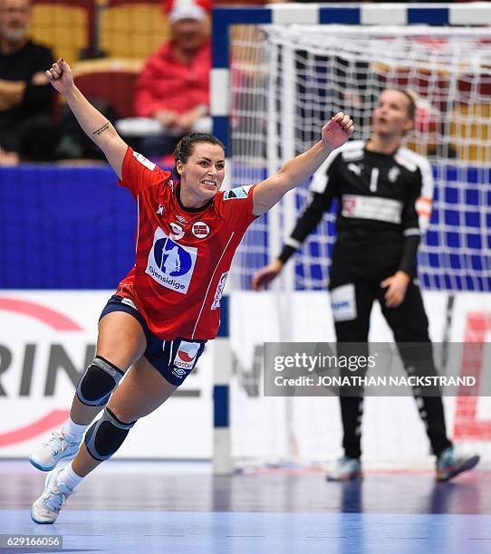 Norway's Nora Mork celebrates after scoring a goal during the Women's European Handball Championship Group II match between Denmark and Norway in...